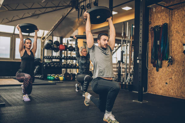 istock Lady's practicing together with fitness coach in gym 1092665802