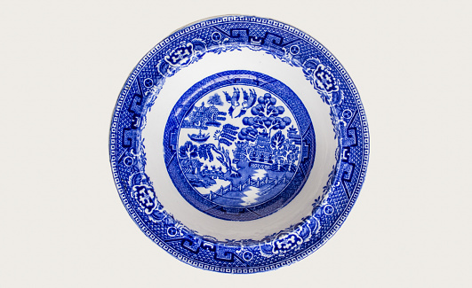 Old willow pattern blue and white plate