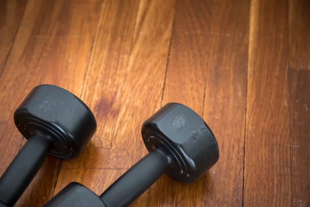 istock Sport Training Weight Dumbles on Wooden Ground 1092670978