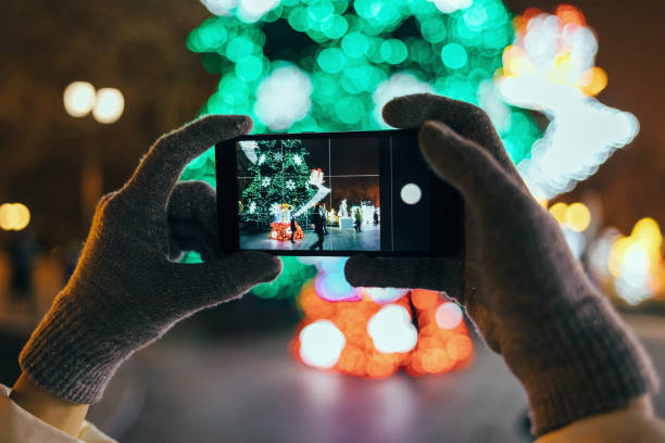 istock Woman's hands wearing warm gloves using mobile phone 1092671268