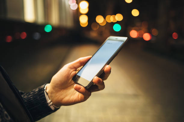 istock Close-up woman's hand holding mobile phone 1092671464