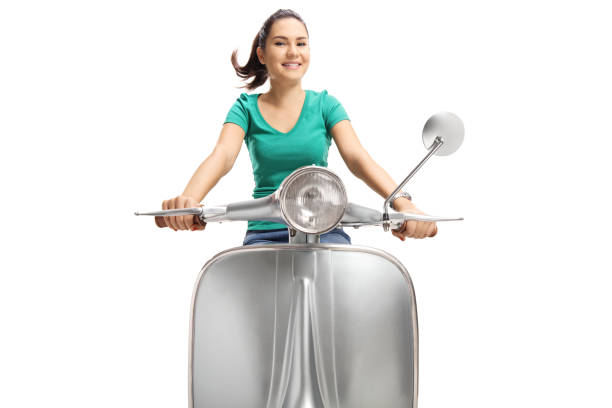istock Cute young female riding a vintage scooter 1092673912