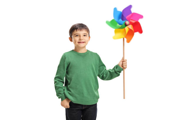 istock Smiling boy holding a colorful windmill toy 1092674388