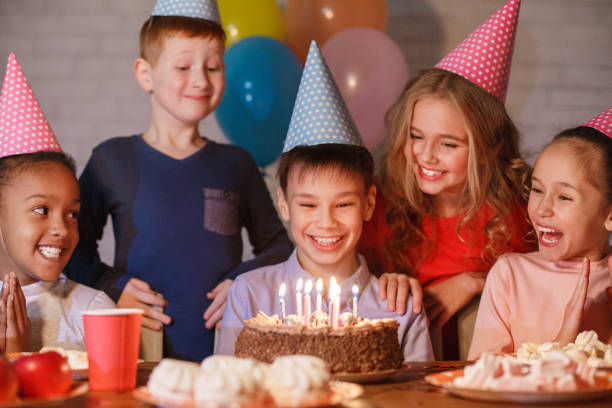 istock Boy celebrating birthday and making wish at home 1092674568