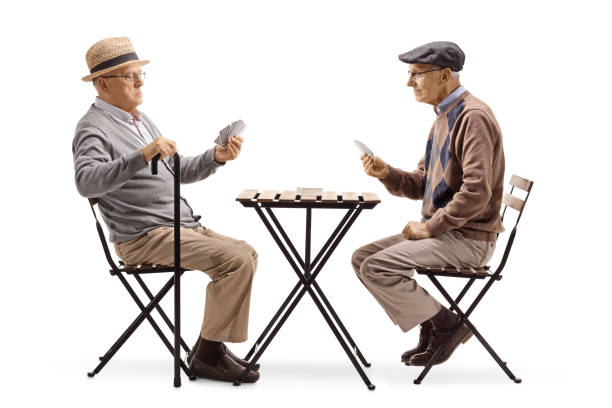 istock Two senior men playing cards at a table 1092676198