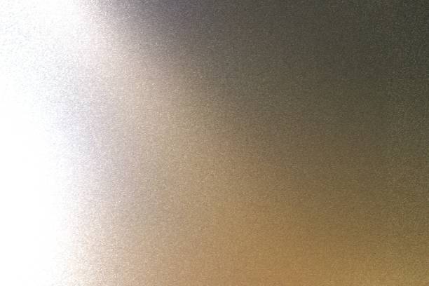 istock Light shining on rough black metal wall texture, abstract background 1092676782