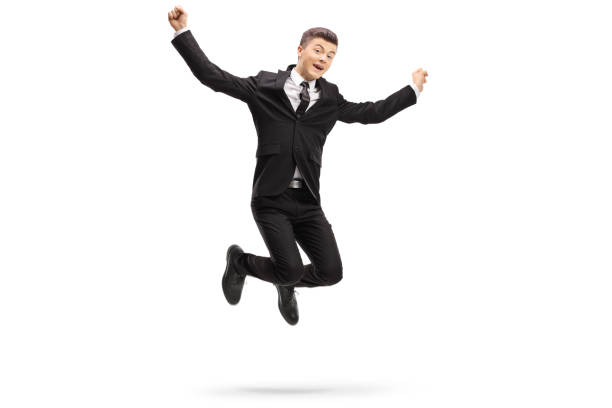 istock Elegant young man in a suit jumping 1092676832