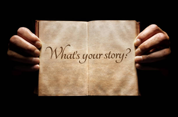 What's your story? hands holding an open book background