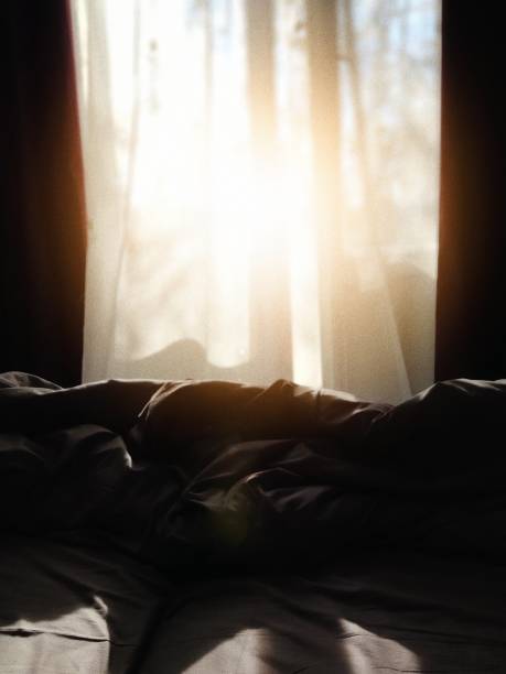 istock Beautiful sun light in the morning with messy bed 1092684972