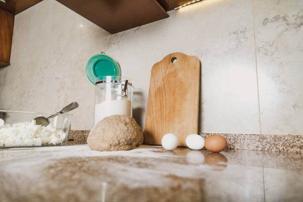 istock Kitchen still life. Dough, flour and eggs are on tabletop 1092685260