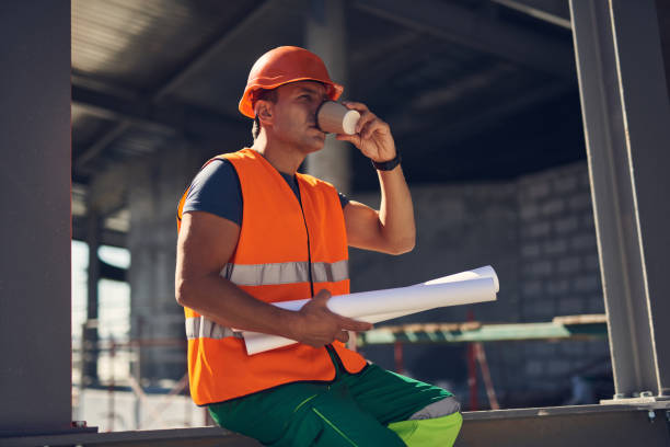 istock Calm foreman sitting alone and drinking morning coffee 1092688334