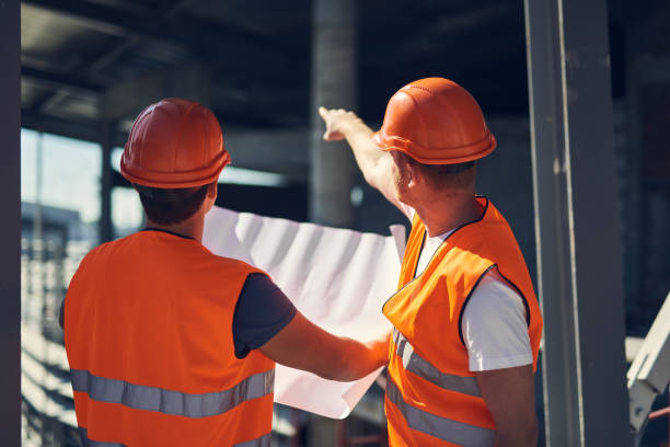 istock Professional foreman pointing to the distance while showing the direction 1092688400