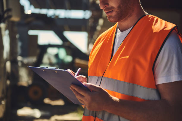 istock Close up of the builder making notes in his clipboard 1092688478