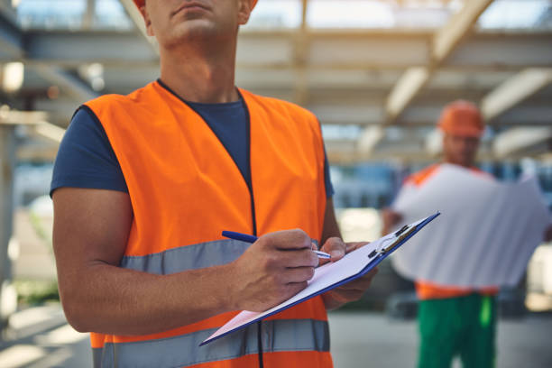 istock Two employees are standing at the construction site 1092688538