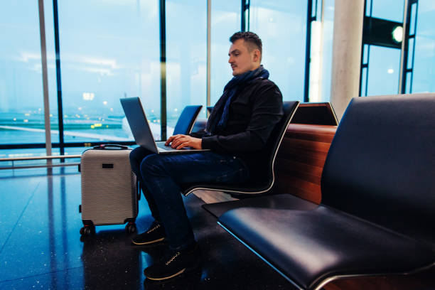 istock Male Passenger Using Laptop Computer at the Airport 1092689326