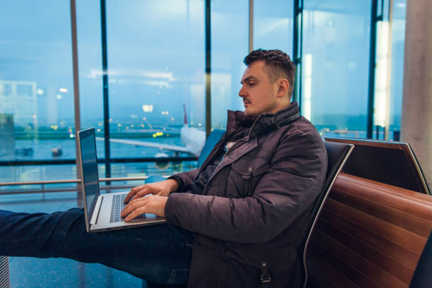 istock Male Passenger Using Laptop Computer at the Airport 1092689342