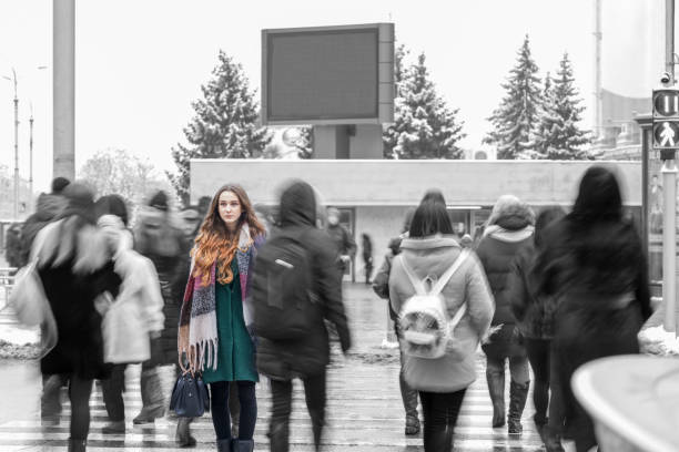 istock woman standing out from the crowd 1092691130