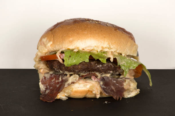 istock a delicious hamburger with cheese and pickles 1092694142