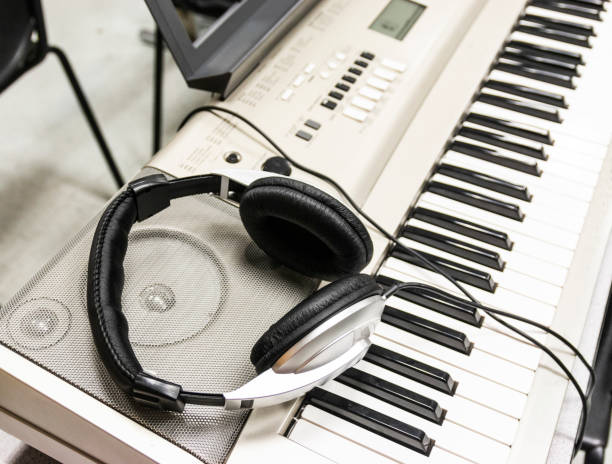 istock Electric piano with headphones 1092694450