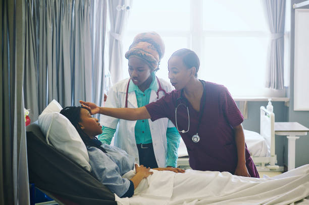 istock Female doctor doing her rounds checking patient 1092696660