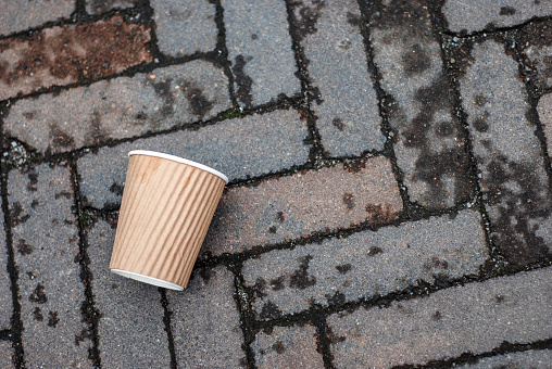 Paper coffee cup waste on floor