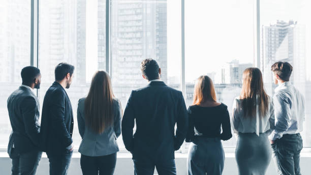 istock Businesspeople having break at meeting, back view 1092705978