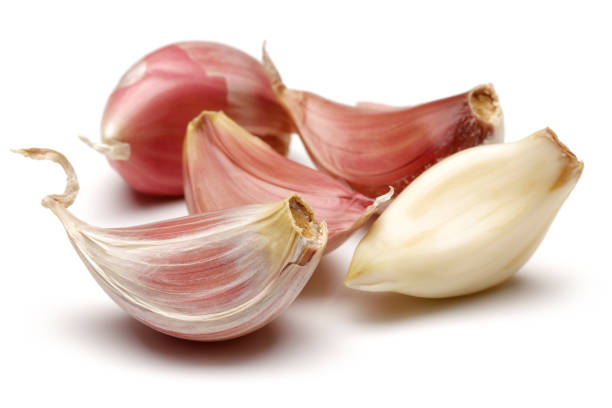 istock Garlic cloves on white background 1092706578