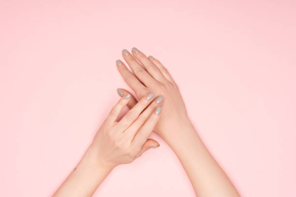 istock top view of female hands isolated on pink 1092706754