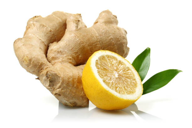 istock Fresh ginger and lemon with leaves isolated on white background 1092708044