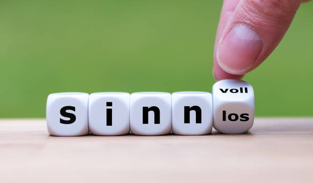 istock Hand turns dice and changes the german word 