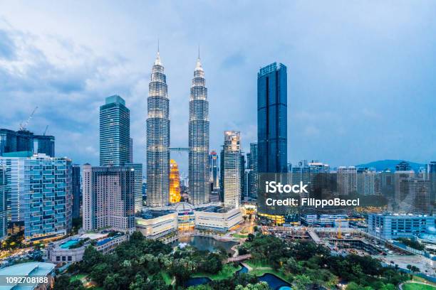 Kuala Lumpur Skyline With Petronas Towers At Sunset Stock Photo - Download Image Now