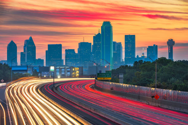 Dallas, Texas, USA downtown skyline and highway Dallas, Texas, USA downtown skyline and highway at dawn. dallas texas stock pictures, royalty-free photos & images