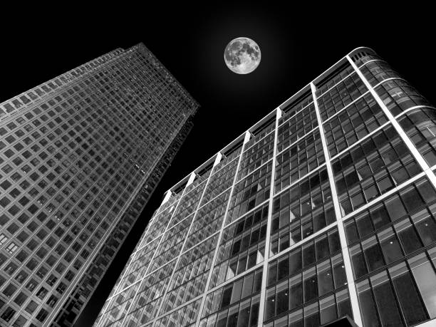 istock skyscraper buildings architecture with a full moon 1092724282