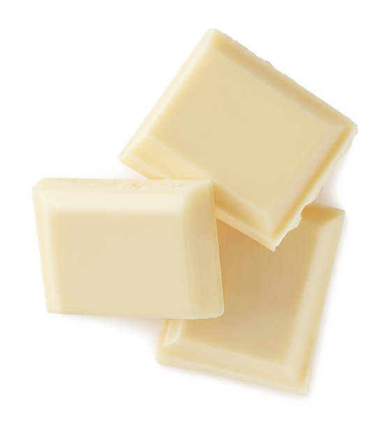 istock White chocolate pieces isolated on white background 1092727846