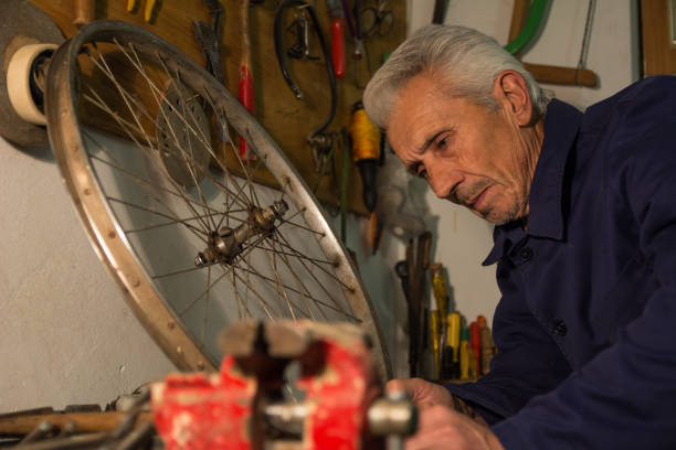 istock Tired old mechanic resting in his old workshop 1092732810