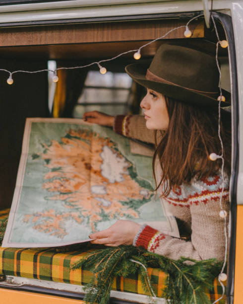istock Woman reading map in old  van 1092735374