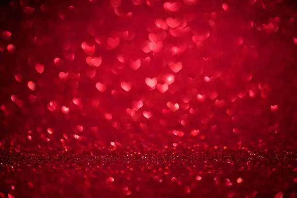 Photo of St. Valentine's Day red bokeh background with love heart, place for text