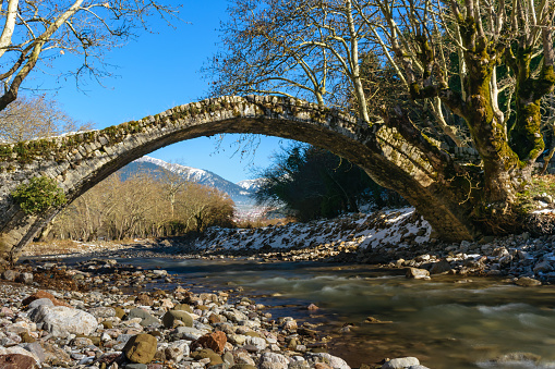 Old stone arched bridge over Karpenisiotis river, Karpenisi