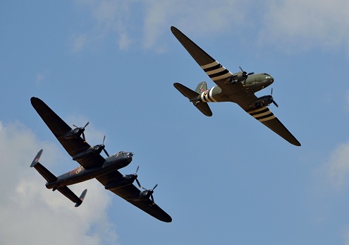 Avro Lancaster Bomber and C-47 Dakota aircraft in close formation as part of the Battle of Britain Memorial flight display in 2018