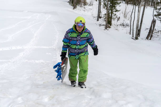 istock Snowboarder in the mountains on a forest background 1092749460
