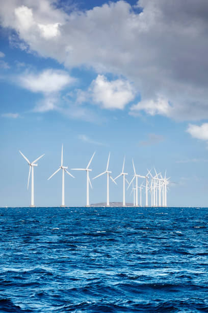 istock Offshore windmill farm on a sunny day 1092749804