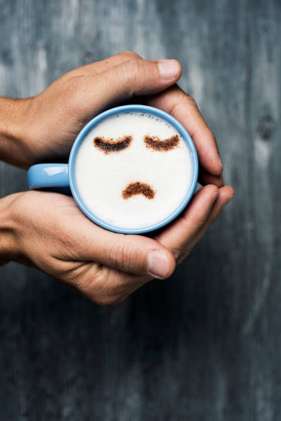 istock man with a cup of cappuccino with a sad face 1092754496