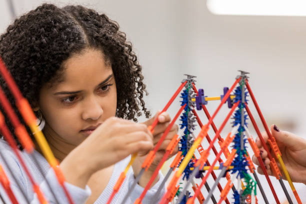 istock Teenage girl concentrates during engineering class 1092757650