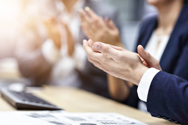istock Midsection of businesspeople clapping hands at conference 1092758368