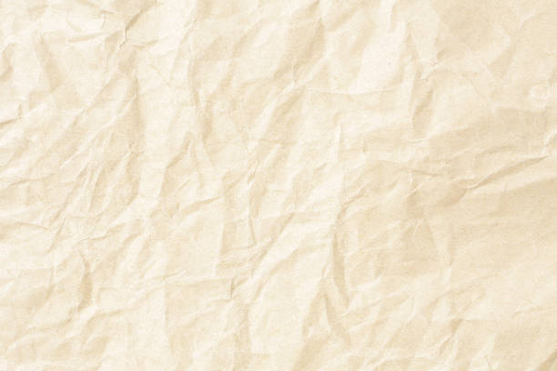 istock Crumpled brown background paper texture 1092761560