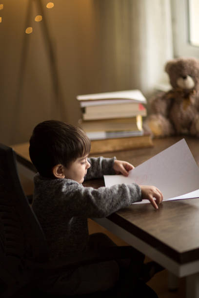 istock Adorable little boy, drawing picture 1092765180