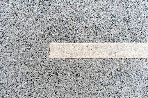 Outdoor road with white line marking on the right side texture. Perfect for background.