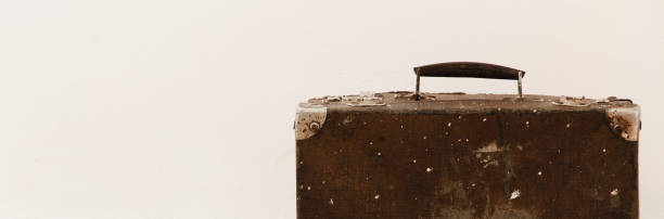 istock Crop view of isolated vintage suitcase on white background, space for text 1092769302