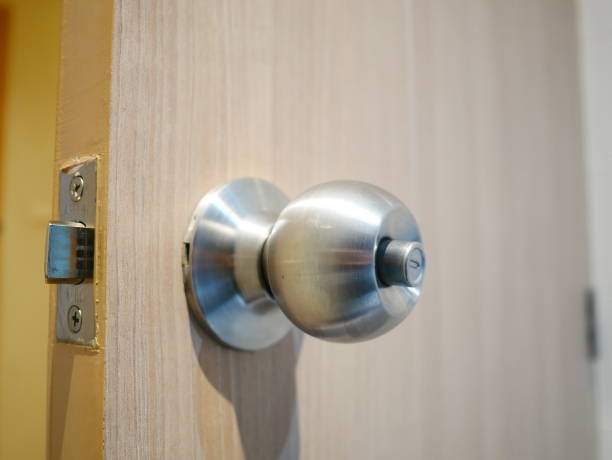 istock etal Brass Door Knob on white wall 1092778422