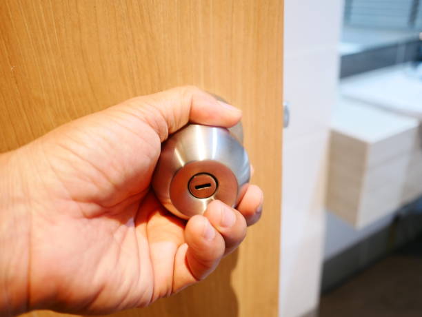 istock etal Brass Door Knob on white wall 1092778758